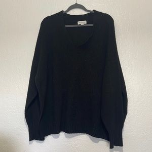 V-neck black sweater. Size XXXL, high cut sides.